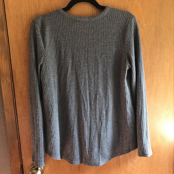 Cute dark grey shirt that also fits a medium. - Picture 2 of 3